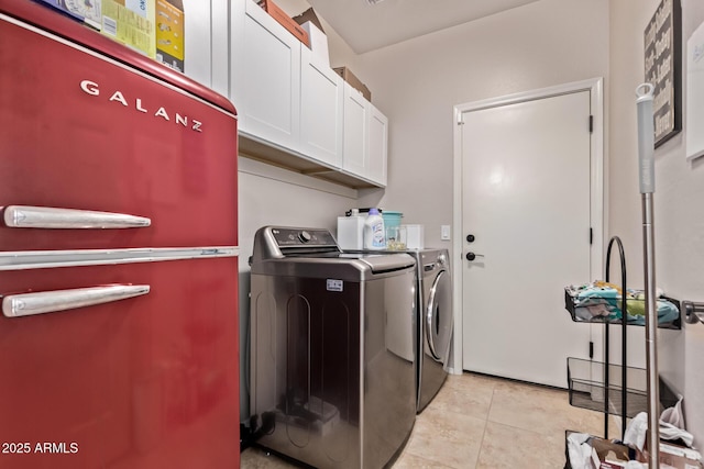 7031 W Lone Tree Trl, Peoria, AZ 85383 - laundry area with cabinet space, washing machine and dryer, and light tile patterned floors
