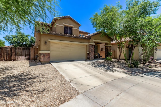 7031 W Lone Tree Trl, Peoria, AZ 85383 - mediterranean / spanish-style home featuring stone siding, driveway, stucco siding, a tile roof, and a gate