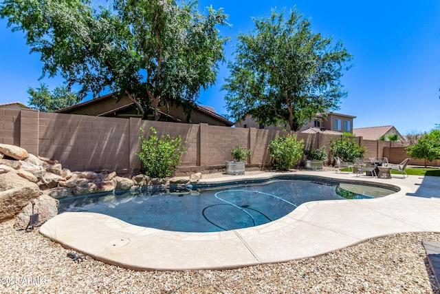 7031 W Lone Tree Trl, Peoria, AZ 85383 - view of swimming pool featuring a patio area and a fenced backyard