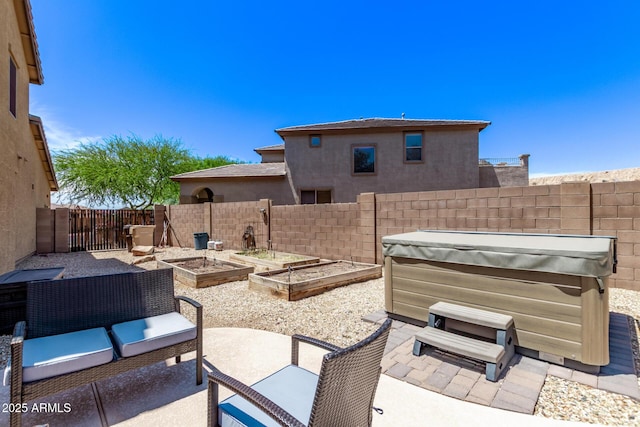 7031 W Lone Tree Trl, Peoria, AZ 85383 - fenced backyard featuring a hot tub, a patio area, and a garden