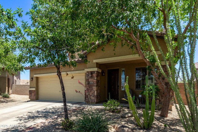 7031 W Lone Tree Trl, Peoria, AZ 85383 - view of front of home with a garage, concrete driveway, stone siding, and stucco siding