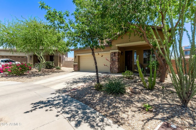 7031 W Lone Tree Trl, Peoria, AZ 85383 - view of front of home featuring an attached garage, driveway, stucco siding, and stone siding