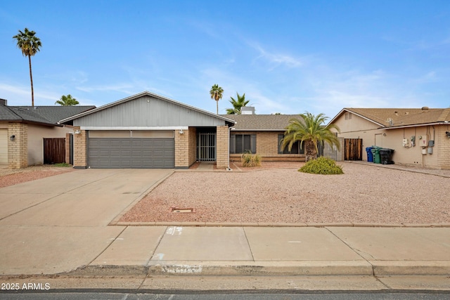 3106 S Extension Rd, Mesa, AZ 85210 - ranch-style house featuring brick siding, a garage, and driveway
