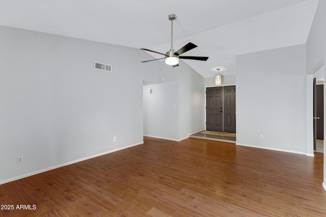 3106 S Extension Rd, Mesa, AZ 85210 - unfurnished living room featuring vaulted ceiling, a ceiling fan, wood finished floors, and baseboards