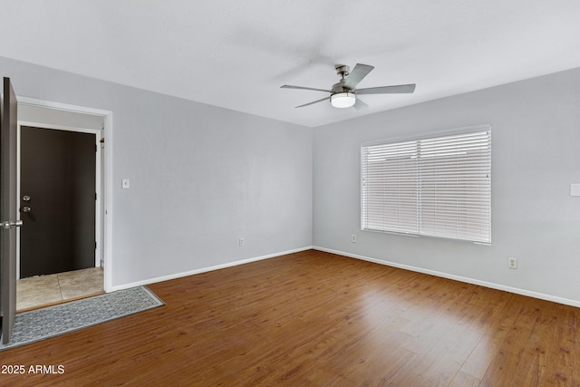 3106 S Extension Rd, Mesa, AZ 85210 - unfurnished room featuring a ceiling fan, wood finished floors, and baseboards