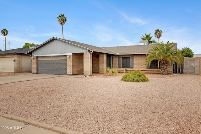 3106 S Extension Rd, Mesa, AZ 85210 - single story home featuring brick siding, a garage, driveway, and roof with shingles