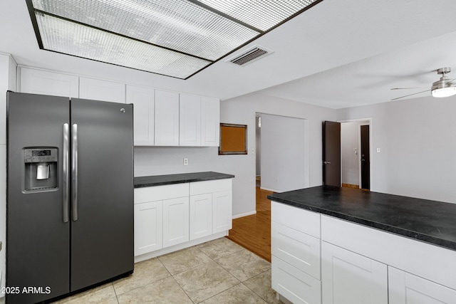 3106 S Extension Rd, Mesa, AZ 85210 - kitchen featuring stainless steel fridge with ice dispenser, white cabinetry, and dark countertops