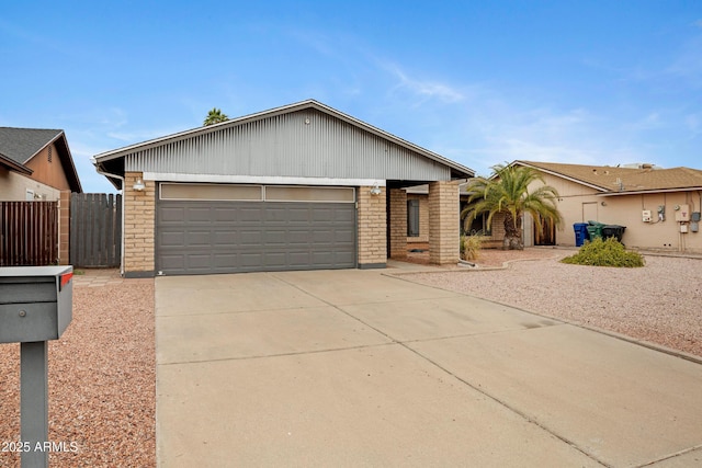3106 S Extension Rd, Mesa, AZ 85210 - ranch-style home featuring brick siding, a garage, and driveway