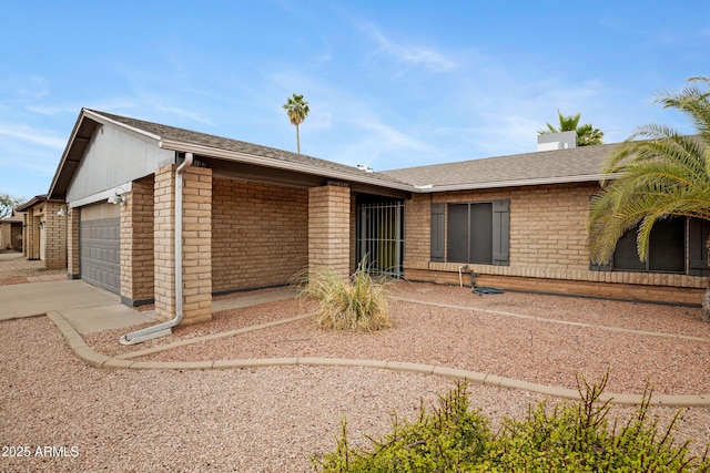 3106 S Extension Rd, Mesa, AZ 85210 - view of front facade with a garage, brick siding, concrete driveway, and roof with shingles