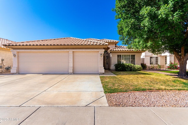 3412 E Kristal Way, Phoenix, AZ 85050 - mediterranean / spanish-style home with concrete driveway, stucco siding, a garage, a tiled roof, and a front lawn