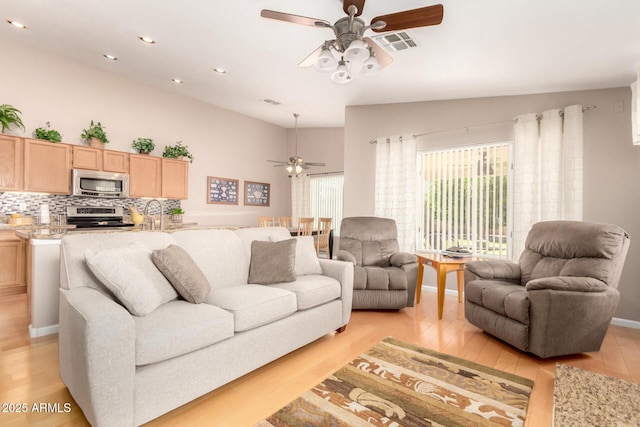 3412 E Kristal Way, Phoenix, AZ 85050 - living area with ceiling fan, light wood-style floors, recessed lighting, and vaulted ceiling