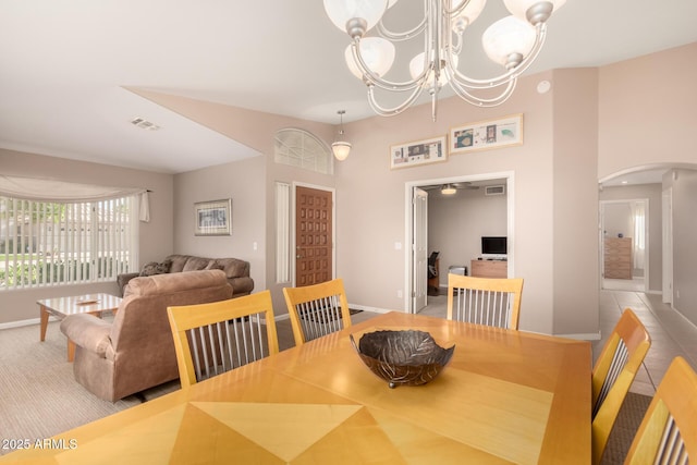 3412 E Kristal Way, Phoenix, AZ 85050 - dining space featuring arched walkways, baseboards, and a chandelier