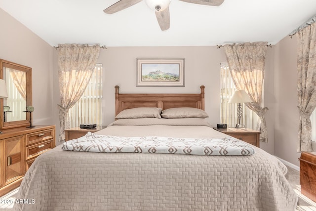 3412 E Kristal Way, Phoenix, AZ 85050 - bedroom with multiple windows, ceiling fan, and baseboards
