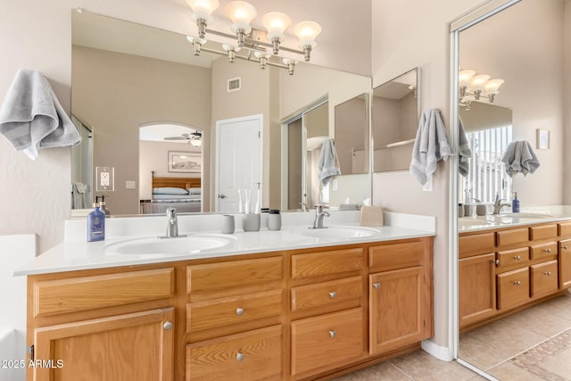 3412 E Kristal Way, Phoenix, AZ 85050 - ensuite bathroom featuring double vanity, tile patterned floors, and a ceiling fan