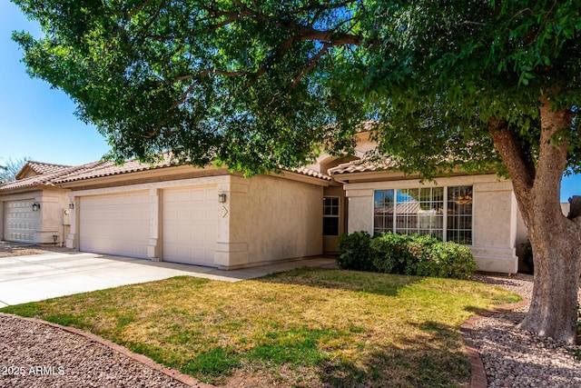 3412 E Kristal Way, Phoenix, AZ 85050 - view of front of house with a tiled roof, stucco siding, a garage, concrete driveway, and a front yard