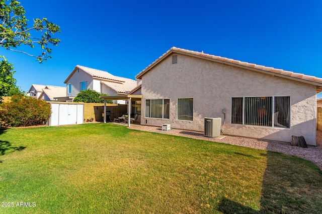 3412 E Kristal Way, Phoenix, AZ 85050 - back of house featuring stucco siding, a lawn, cooling unit, a patio, and a tile roof