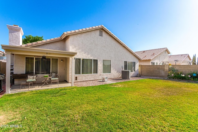 3412 E Kristal Way, Phoenix, AZ 85050 - back of house with stucco siding, a patio area, a chimney, central AC unit, and a ceiling fan