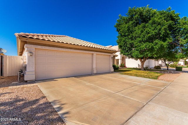 3412 E Kristal Way, Phoenix, AZ 85050 - mediterranean / spanish home with a tiled roof, stucco siding, and driveway