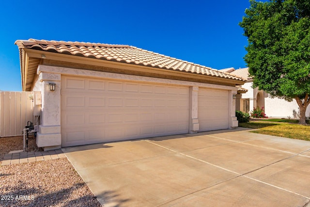 3412 E Kristal Way, Phoenix, AZ 85050 - view of front facade with driveway, stucco siding, a tile roof, and an attached garage