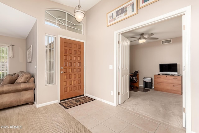 3412 E Kristal Way, Phoenix, AZ 85050 - foyer entrance with light colored carpet, baseboards, a ceiling fan, and light tile patterned floors