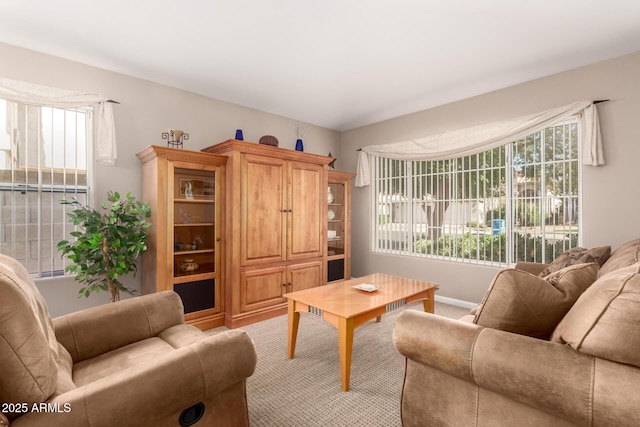 3412 E Kristal Way, Phoenix, AZ 85050 - living room featuring light colored carpet, plenty of natural light, and baseboards