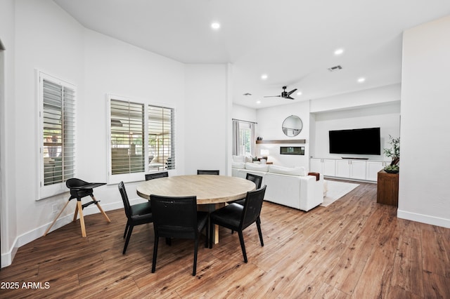 dining area with recessed lighting, baseboards, visible vents, and hardwood / wood-style floors