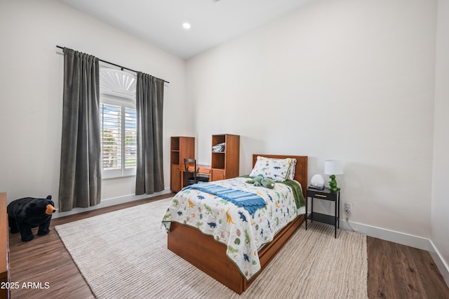 bedroom with recessed lighting, baseboards, and wood finished floors