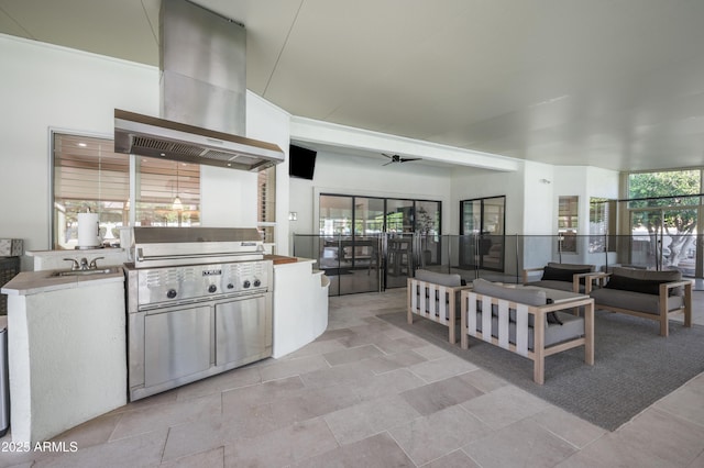 interior space with ceiling fan, extractor fan, and a sink