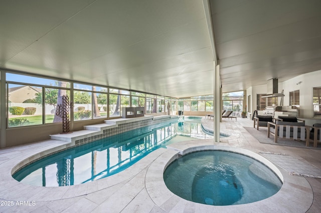 pool with glass enclosure, an indoor in ground hot tub, and a patio