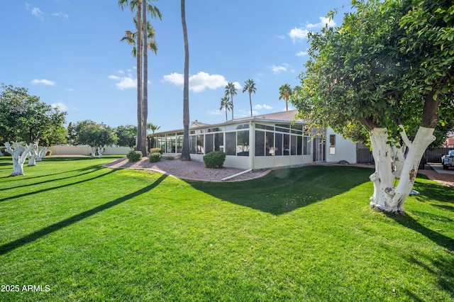 view of yard featuring a sunroom