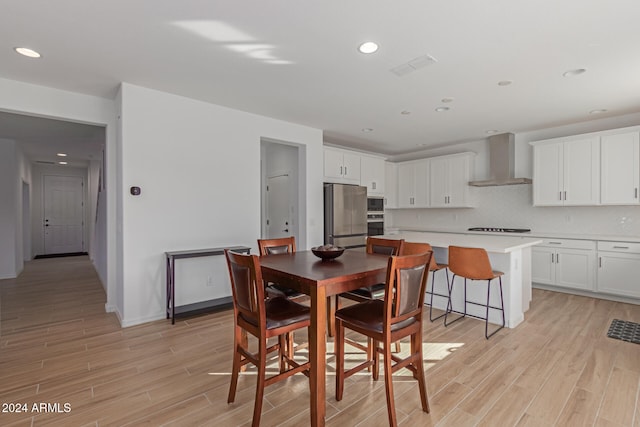 dining area with light wood-type flooring