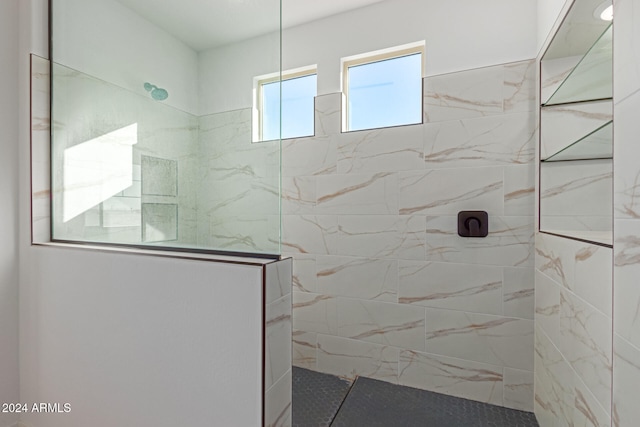 bathroom with a tile shower