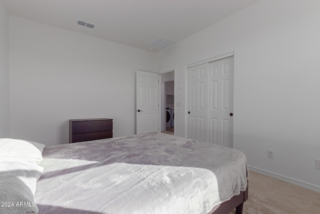 carpeted bedroom with a closet