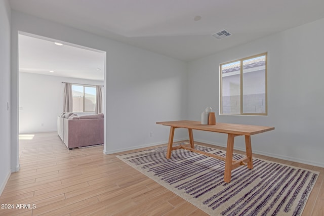 office space with light wood-type flooring