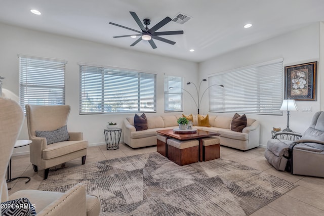 living room featuring ceiling fan and light tile patterned floors