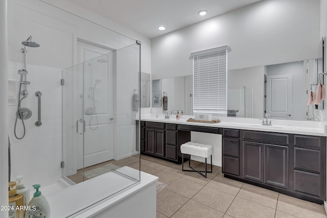 bathroom featuring vanity, an enclosed shower, and tile patterned floors