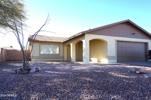 ranch-style home with a garage