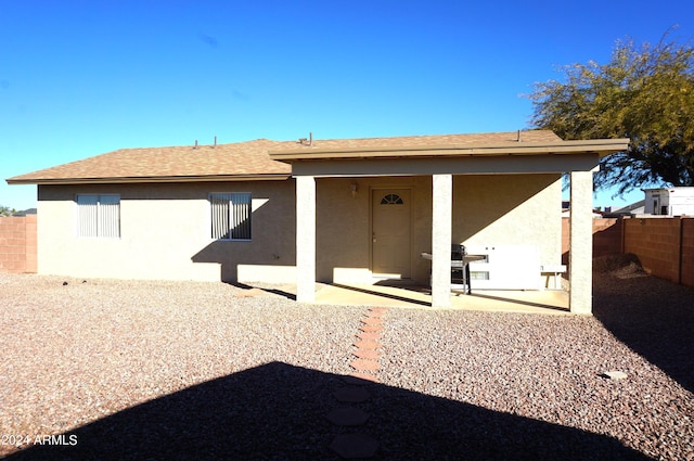 back of property with a patio area