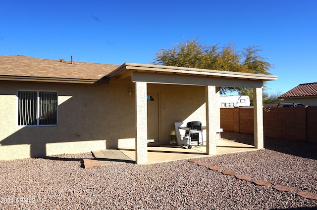 back of house with a patio area