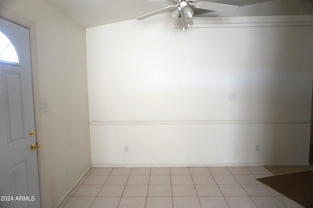 unfurnished room with ceiling fan and light tile patterned flooring