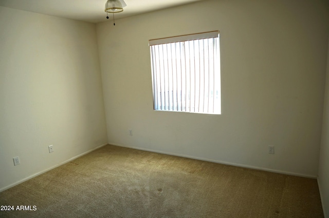 unfurnished room with carpet flooring