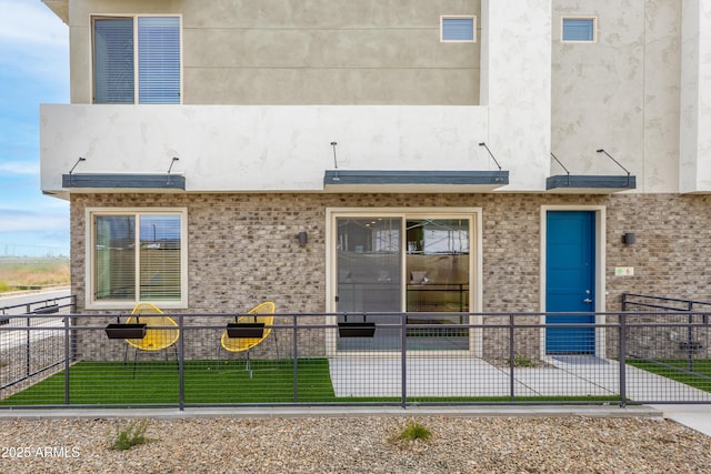 651 N Ironwood Dr Unit 8, Apache Junction, AZ 85120 - rear view of house with stucco siding and brick siding
