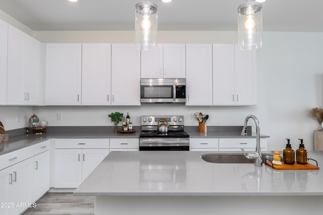 651 N Ironwood Dr Unit 8, Apache Junction, AZ 85120 - kitchen featuring stainless steel appliances, a sink, and white cabinetry