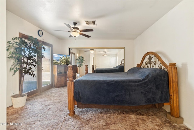 carpeted bedroom featuring access to exterior and ceiling fan