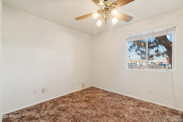 carpeted empty room with ceiling fan