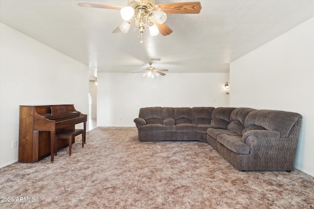 carpeted living room with ceiling fan