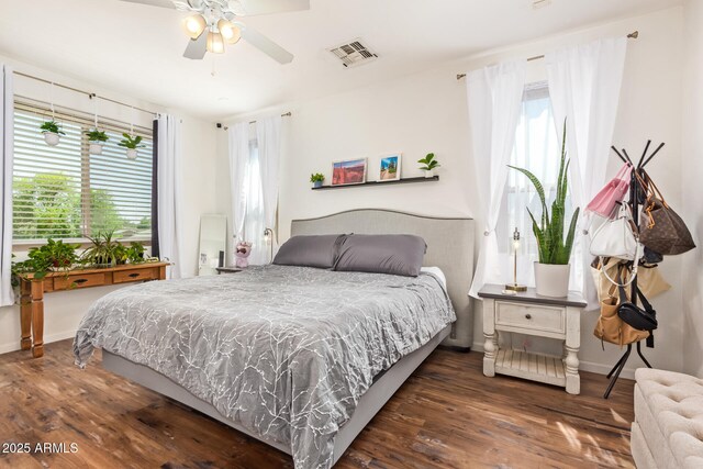 3381 E Canary Way, Chandler, AZ 85286 - bedroom featuring multiple windows, wood finished floors, and baseboards