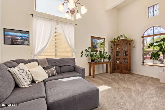 3381 E Canary Way, Chandler, AZ 85286 - carpeted living room featuring a high ceiling and a chandelier