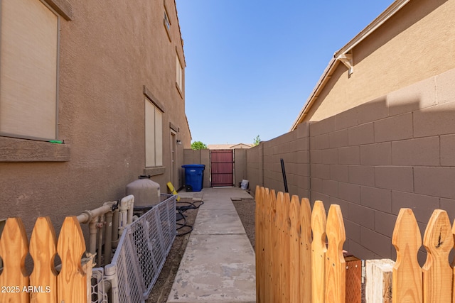 3381 E Canary Way, Chandler, AZ 85286 - view of home's exterior with stucco siding, a gate, and fence