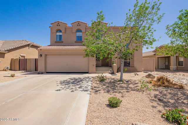 3381 E Canary Way, Chandler, AZ 85286 - mediterranean / spanish home featuring stucco siding, an attached garage, a tiled roof, concrete driveway, and fence